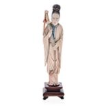 A CHINESE CARVED STAINED IVORY FIGURE OF MU GUIYING, LATE 19TH CENTURY NOT SUITABLE FOR EXPORT the