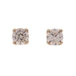 A PAIR OF DIAMOND EAR STUDS each claw-set with a round brilliant-cut diamond weighing 2.018cts and