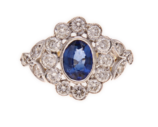 A SAPPHIRE AND DIAMOND RING centred with an oval mixed-cut sapphire weighing 0.76cts, within a