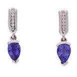 A PAIR OF TANZANITE AND DIAMOND PENDANT EARRINGS each rectangular surmount channel-set with round