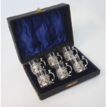 AN EDWARDIAN CASED SET OF SIX SILVER AND GLASS LIQUOR GLASSES, MAKER M&C, BIRMINGHAM, 1904 each