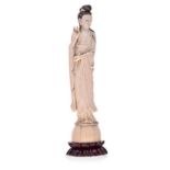 A CHINESE CARVED IVORY FIGURE OF GUANYIN, 19TH CENTURY NOT SUITABLE FOR EXPORT standing, wearing