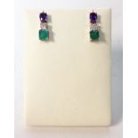 A PAIR OF SAPPHIRE, DIAMOND AND EMERALD PENDANT EARRINGS each surmount claw-set with an oval mixed-