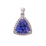 A TANZANITE AND DIAMOND PENDANT centred with a trillion-cut tanzanite weighing 3.05cts, within a