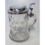 A DUTCH SILVER-MOUNTED GLASS TANKARD, .833 STANDARD the circular body applied with a hinged cover