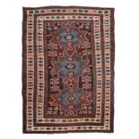 A KUBA RUG, CAUCASIA, CIRCA 1930 the black field with three sky-blue star medallions and guls within