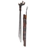 AN IBAN SWORD AND SCABBARD, BORNEO the horn handle carved, bound with rattan and stuffed with trophy