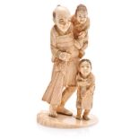 A JAPANESE CARVED IVORY OKIMONO OF A FISHERMAN AND CHILDREN, MEIJI, 1868-1912 NOT SUITABLE FOR