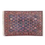 A JOSHEGHAN RUG, PERSIA, MODERN the blue field with an overall design of multi-coloured stylised