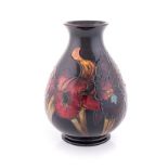 A WILLIAM MOORCROFT FLAMBE ‘ORCHID’ PATTERN VASE, 20TH CENTURY of ovoid form, impressed factory mark