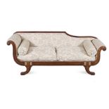 A REGENCY MAHOGANY SETTEE the padded back within a conforming moulded frame, padded scrolling arms