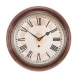 AN ANSONIA RAILWAY STATION EIGHT-DAY WALL CLOCK comprising: a medium oak case with a brass bezel and