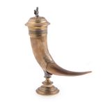 A CONTINENTAL DRINKING HORN WITH BRASS MOUNTS, 19TH CENTURY on a stepped round base with cartouche