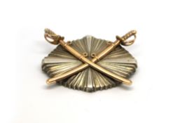 Yellow and white metal brooch