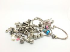 Quantity of modern silver charms and bracelets