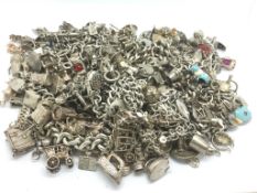 A large quantity of silver charm bracelets
