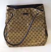 A Gucci Crystal shoulder bag, the coated canvas interior, brown leather trim, model 257375, 30cm