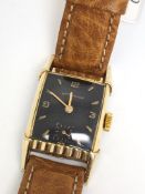 Vintage Wittneuer wrist watch, black rectangular dial with gold baton and Arabic numeral hour
