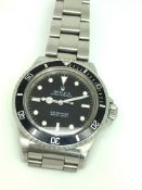 Gentleman's Rolex Oyster Perpetual Submariner, black dial with luminous hour markers, black rotating