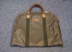 A mulberry scotchgrain suit carrier with brown leather trim, the inside with three zipped