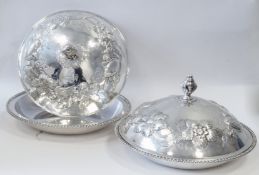 A pair of early nineteenth century Irish silver entree dishes, each of circular form with oblique