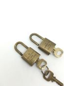 Two brass Louis Vuitton case padlocks with keys, numbered 322