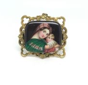 Hand painted Victorian Brooch/Pendant in Yellow metal scrolling border. Closed back. Depicting