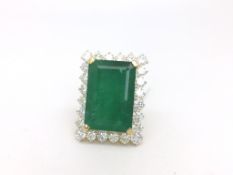 Emerald and diamond ring, rectangular step cut emerald weighing an estimated 25.92cts, surrounded by