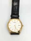 Gentleman's Seiko Gold plated dress watch, white dial with gilt hour markers, date aperture to three