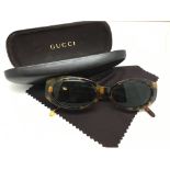 Ladies Gucci sunglasses, tortoise shell effect frames, numbered GG2196/S, with case and Gucci wipe