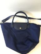 A Longchamp pliage small tote, navy blue canvas with blue leather details and detachable grosgrain