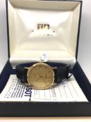 Gentleman's 9ct Tissot Wristwatch, black leather strap, box and papers