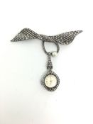 Unusual Silver, Marcasite and Pearl brooch in a bow and snake design. Articulated drop containing