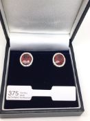 Ruby and diamond earrings, oval cut rubies weighing an estimated total of 4.52ct, claw set with a