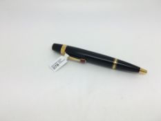 Montblanc Boheme roller ball, gilt metal with black enamel, synthetic ruby coloured stone set clip