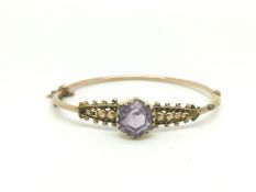 Edwardian 9ct Gold Amethyst bangle with a large amethyst approximately 10mm across. Marked for 9ct