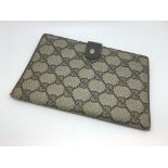 Gucci 'Accessory Collection' monogram wallet, canvas exterior, pigskin interior, 11.5 x 17cm