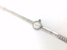 Baume & Mercier diamond cocktail wristwatch, circular dial with diamond bezel and bracelet, all