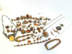 A large quantity of mostly silver amber set Jewellery, including rings, bracelets and pendants,