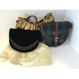 A tartan shoulder bag with brown leather trim, a black velvet clutch bag with diamante details and a