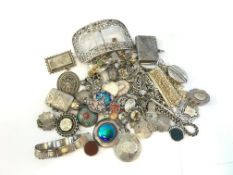 A quantity of mostly antique silver including jewellery, vesta cases, buckles, approximately 588g