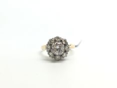 Diamond cluster ring, central brilliant cut diamond weighing an estimated 0.65ct, set with a halo of
