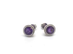 Pair of amethyst stud earrings, round cut amethyst in white metal stamped and tested as 14ct white