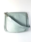 A Longchamp pale blue pebbled shoulder bag, the inside with three compartments lined with