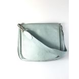 A Longchamp pale blue pebbled shoulder bag, the inside with three compartments lined with