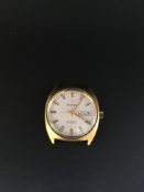 Gentleman's Bulova Day date Watch. The case is a gold plated top with a stainless steel screw