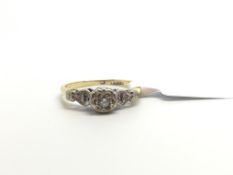 Illusion set diamond ring, centre diamond set with heart shaped shoulders, in yellow and white metal
