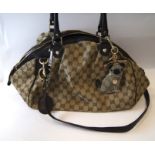 A Gucci 'Sukey' monogram canvas handbag, serial number 223974, with Gucci Pug key charm, 35cm wide