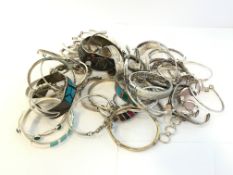 A quantity of mainly silver gem set bangles and bracelets, approximately 908g gross