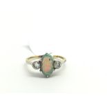 Opal and diamond ring, oval cabochon cut opal set with a transitional cut diamond rub over set to